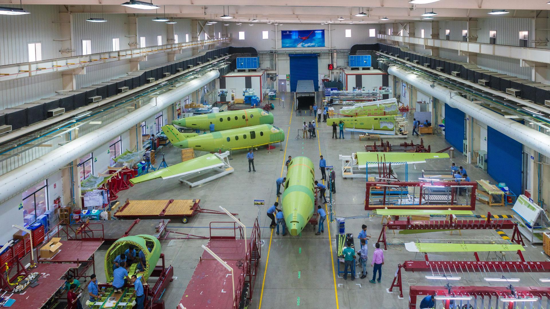 Aircraft fuselage and wing assembly on the factory floor of an aerospace manufacturing facility in Telangana