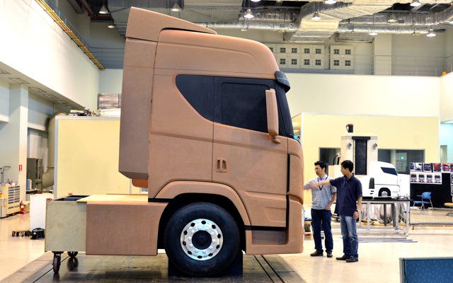 A full-size clay model under review in a design studio