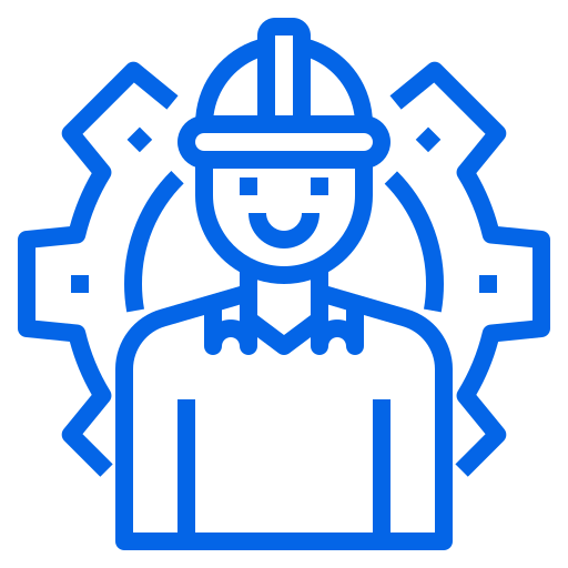A worker in a safety helmet between two gears