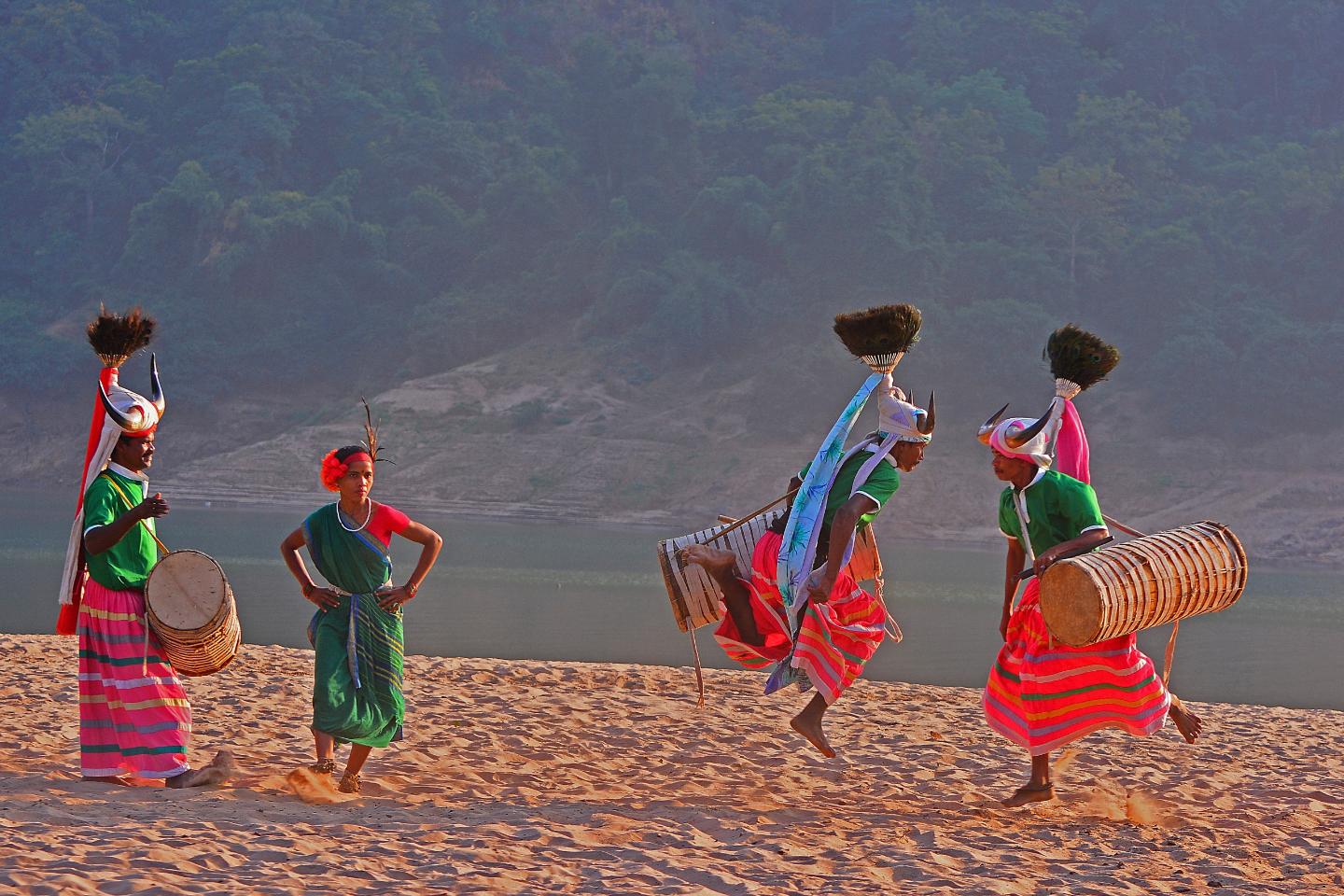 Kommu Koya tribal dancers on a riverbank